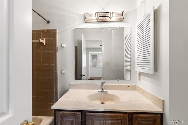 bathroom with tub / shower combination and vanity