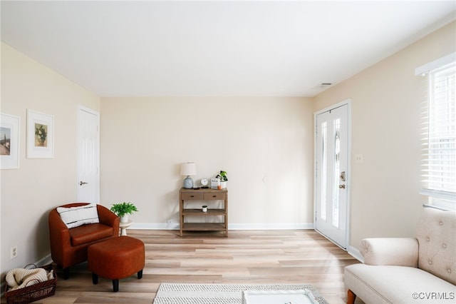 sitting room featuring light wood-style floors and baseboards