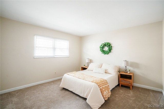 carpeted bedroom with baseboards