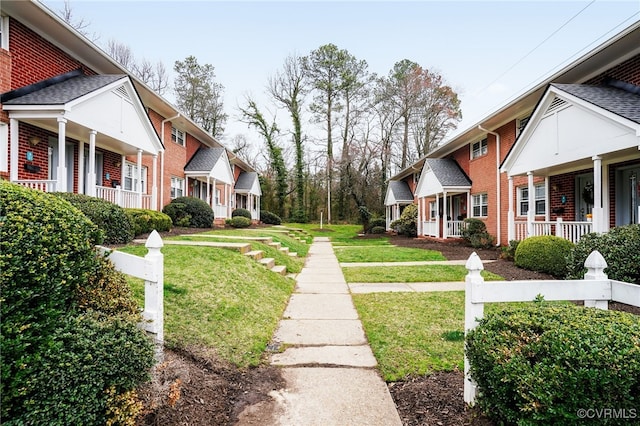 surrounding community featuring a residential view and a yard