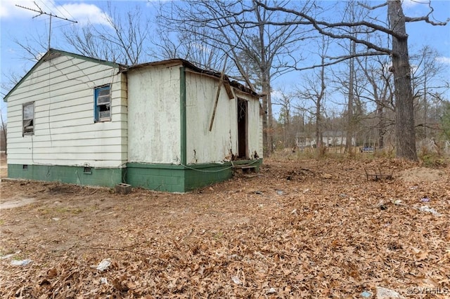 view of property exterior featuring crawl space