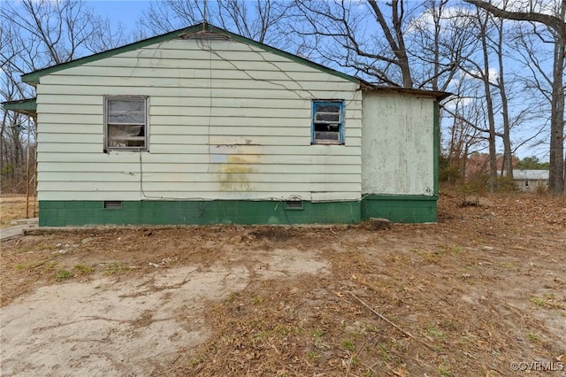 view of side of home with crawl space