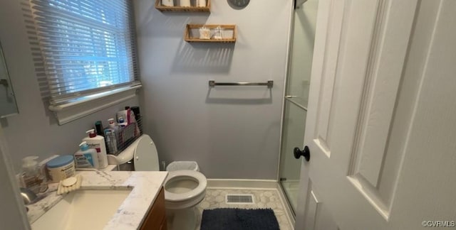 full bathroom with visible vents, toilet, a shower stall, baseboards, and vanity