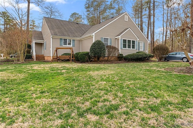 single story home with roof with shingles and a front yard