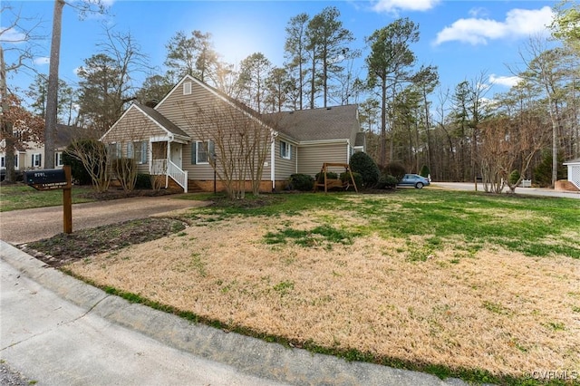 view of side of property with a yard