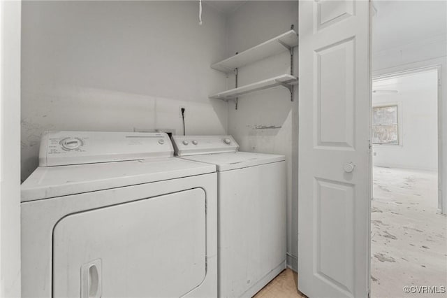 laundry room with washer and dryer and laundry area