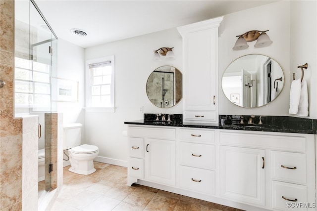 full bathroom with a sink, visible vents, toilet, and a shower stall