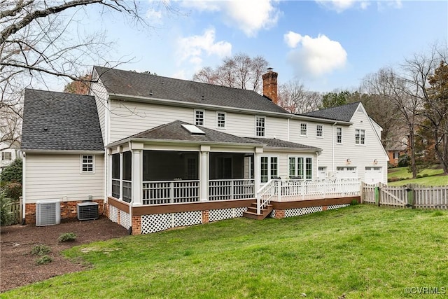 rear view of property featuring fence, central air condition unit, a chimney, a sunroom, and a gate