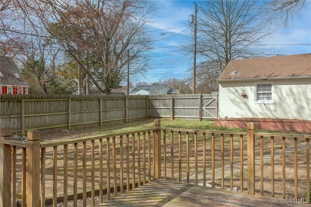 wooden deck featuring a fenced backyard