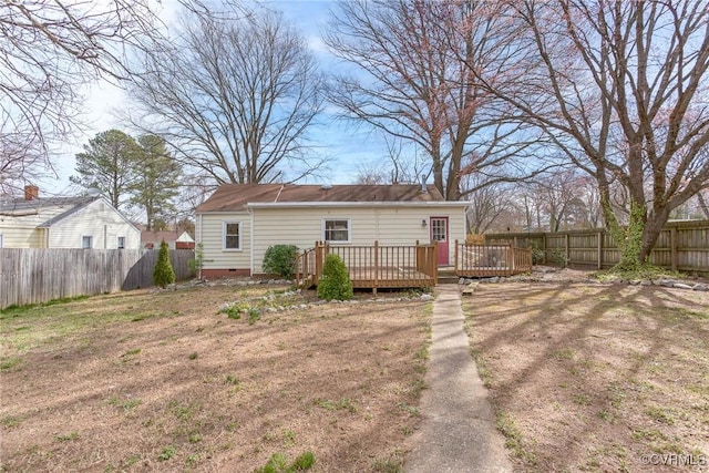 rear view of property with a wooden deck, a fenced backyard, and crawl space