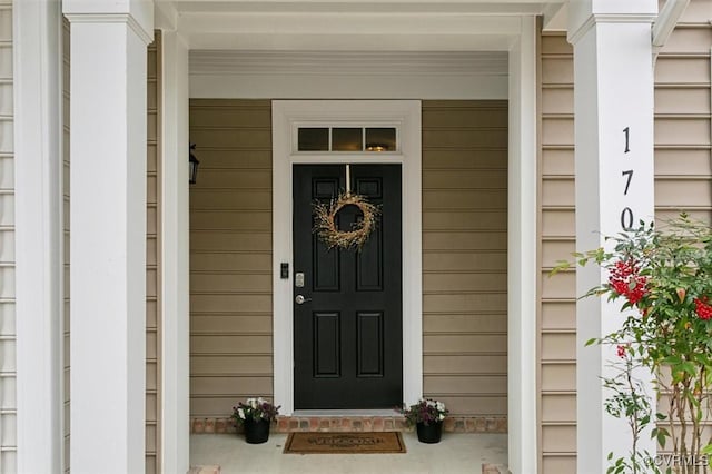 doorway to property featuring covered porch