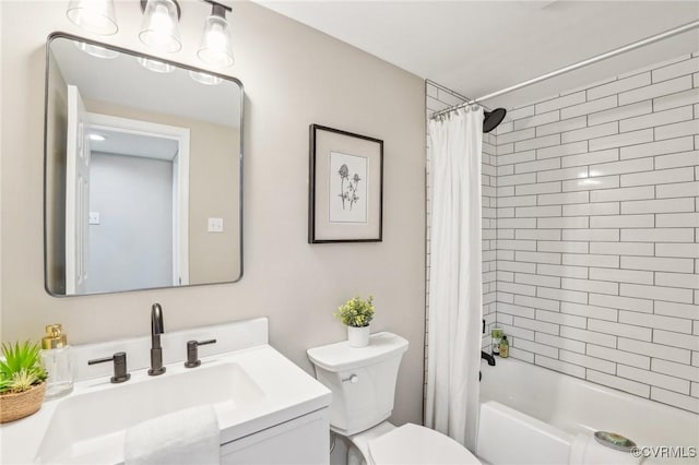 bathroom with vanity, toilet, and shower / tub combo with curtain