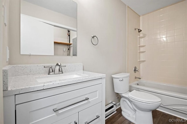 bathroom featuring shower / bathing tub combination, toilet, wood finished floors, and vanity