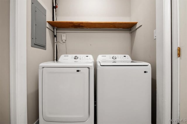 laundry area featuring electric panel and independent washer and dryer