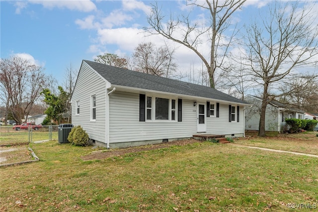 view of front of home with a front yard, fence, central AC, a shingled roof, and crawl space