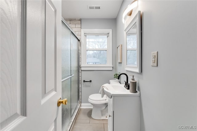 full bath with visible vents, toilet, a stall shower, and vanity