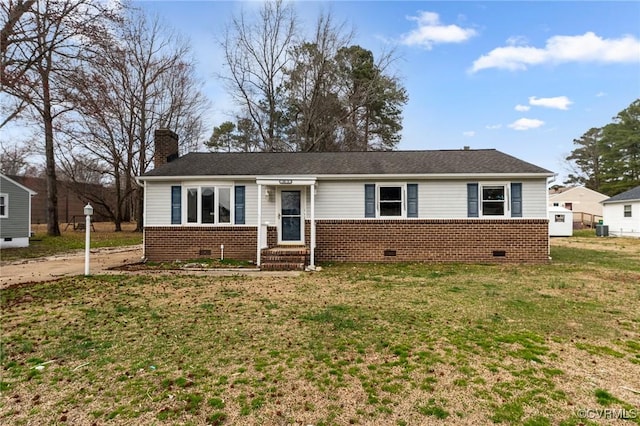 single story home featuring crawl space, a front yard, brick siding, and a chimney