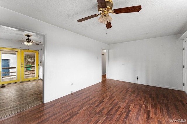 spare room featuring visible vents, a textured ceiling, wood finished floors, and a ceiling fan