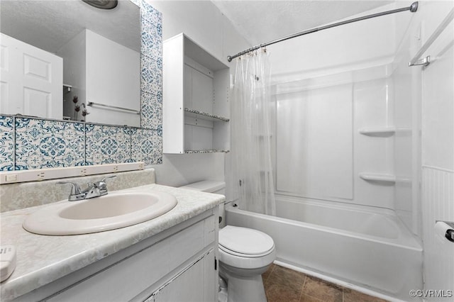 full bath featuring toilet, vanity, tile patterned floors, shower / bath combination with curtain, and a textured ceiling