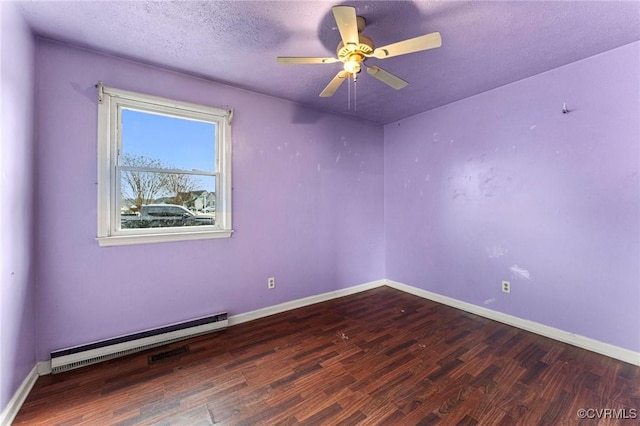 spare room with baseboards, wood finished floors, a textured ceiling, a ceiling fan, and a baseboard radiator