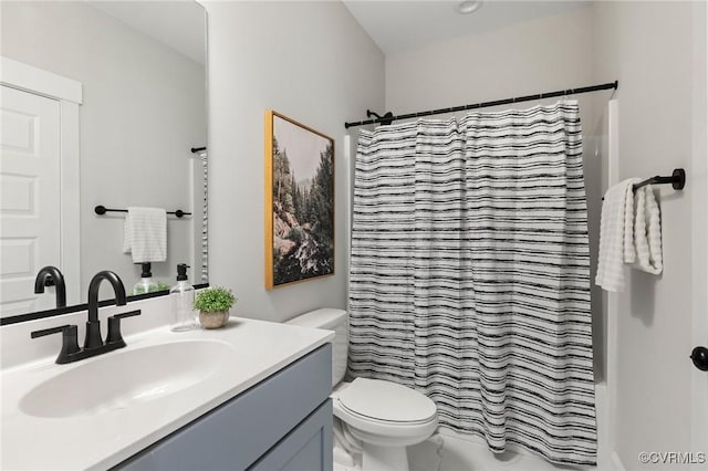 full bath with shower / bath combo with shower curtain, marble finish floor, toilet, and vanity