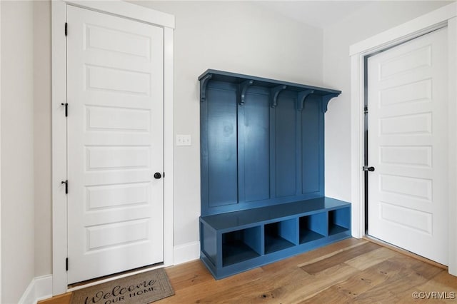 mudroom with baseboards and light wood-type flooring