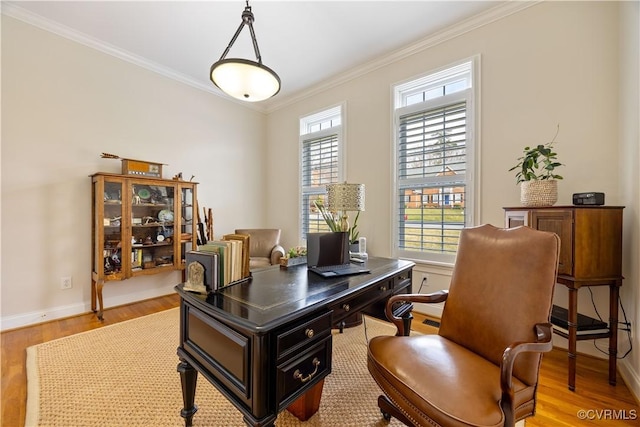 office area with crown molding, light wood-style floors, and baseboards