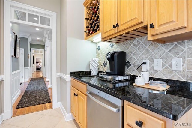 kitchen with ornamental molding, light brown cabinets, a sink, light tile patterned flooring, and dishwasher