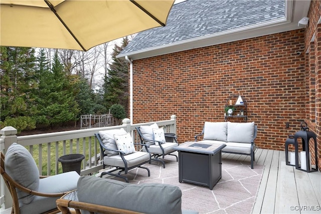 wooden deck featuring an outdoor living space