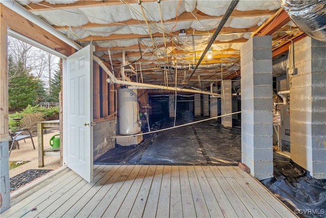 interior space with gas water heater and hardwood / wood-style flooring