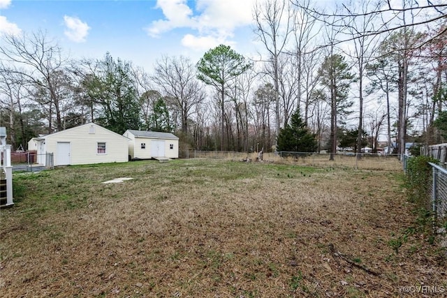 view of yard with an outbuilding and a fenced backyard