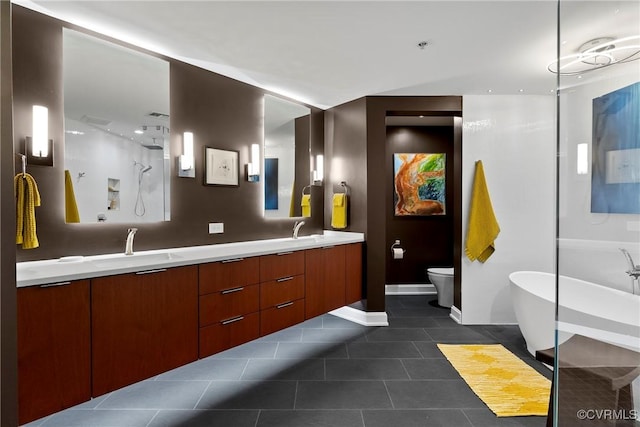 full bathroom featuring double vanity, tile patterned floors, a soaking tub, a shower, and a sink