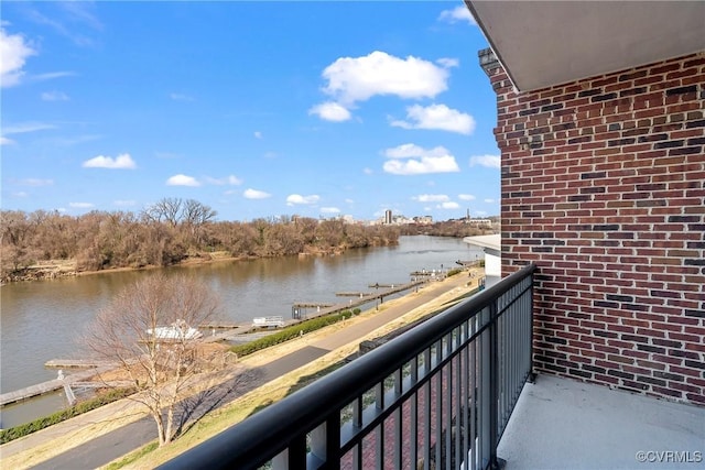 balcony featuring a water view