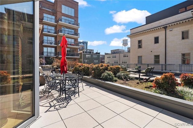 balcony with a city view and a patio