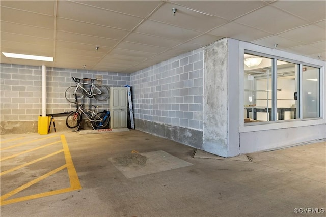 garage featuring concrete block wall