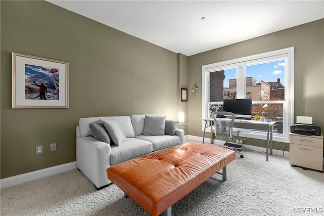 living room featuring light colored carpet and baseboards