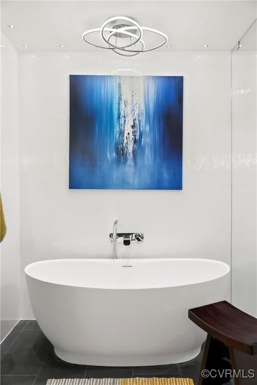 bathroom with recessed lighting, a soaking tub, and tile patterned flooring