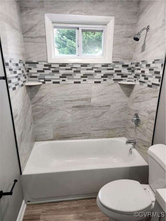 full bathroom featuring toilet, shower / washtub combination, and wood finished floors