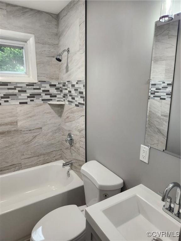 full bath featuring shower / washtub combination, toilet, and vanity