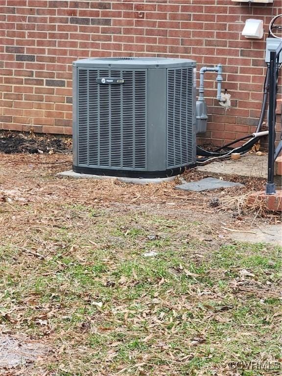 details with brick siding and central AC unit