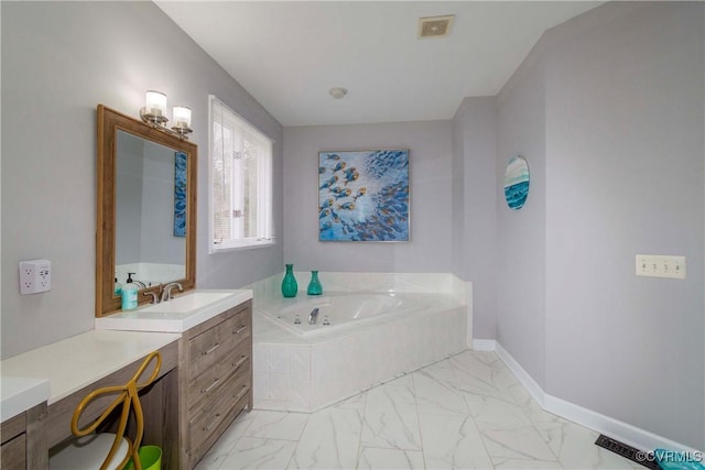 full bath featuring visible vents, baseboards, a garden tub, and marble finish floor