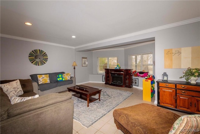 living room with light tile patterned floors, recessed lighting, ornamental molding, and a fireplace