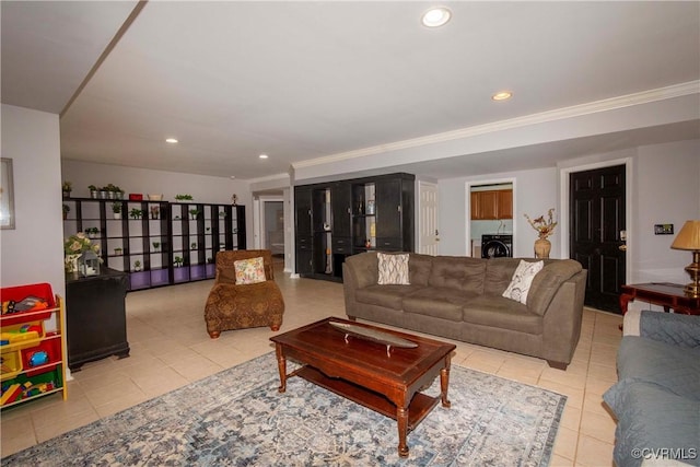 living area with light tile patterned floors, recessed lighting, and independent washer and dryer