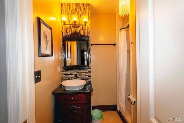 bathroom featuring tile patterned floors, curtained shower, decorative backsplash, a chandelier, and vanity