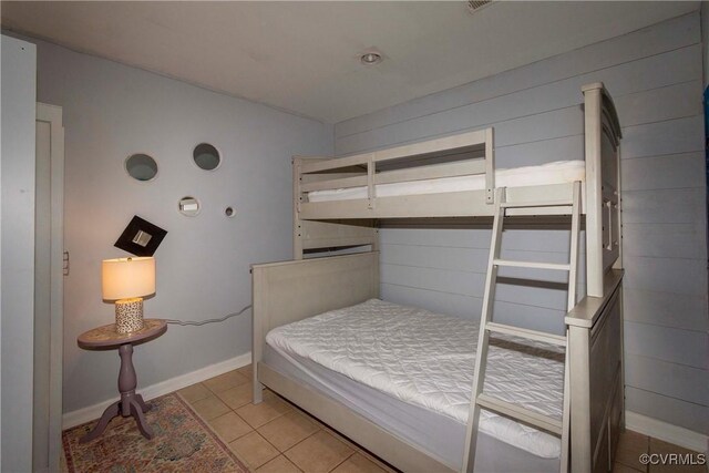 tiled bedroom with baseboards