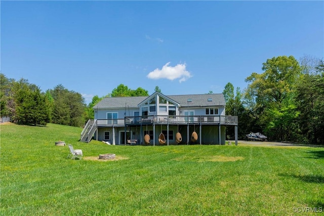 6210 Stubbs Cove Ln, Spotsylvania, VA 22551 - rear view of house featuring a yard, an outdoor fire pit, a deck, and stairway