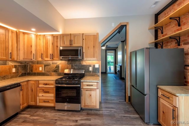 kitchen with backsplash, dark wood-type flooring, light brown cabinetry, light countertops, and stainless steel appliances