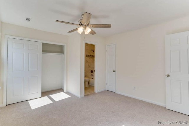 unfurnished bedroom with visible vents, ensuite bath, a closet, baseboards, and light colored carpet