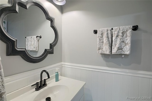 bathroom featuring wainscoting and vanity