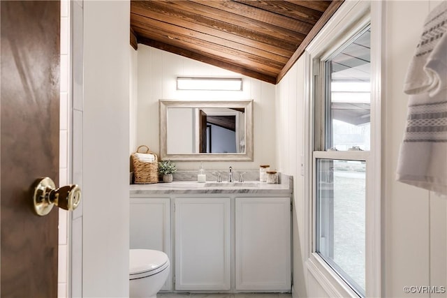 bathroom with toilet, wood ceiling, vanity, and vaulted ceiling